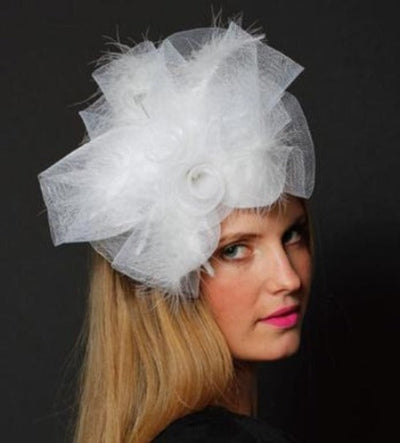 Large white fascinator with white lace, white rose, and white feathers