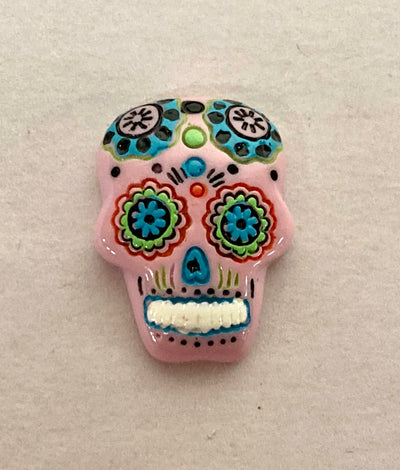 pink sugar skull gem that is 1" long