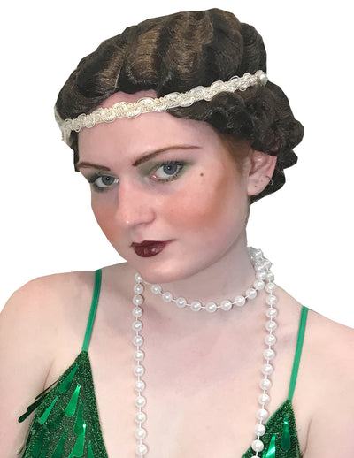 Well, hello there old sport... it's the Gatsby Wig! Take on the golden age of jazz with this 1920's-inspired style. Ideal for anyone drinking a tall Manhattan in a prohibition-era speakeasy. the great gastby  speakeasy  Short Wigs  gatsby wig  gatsby  flapper wig  flapper  daisy  40s  30s  20s